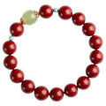 Purple gold sand cinnabar and Hetian jade geometric ellipse bead unisex bracelet on a wrist.