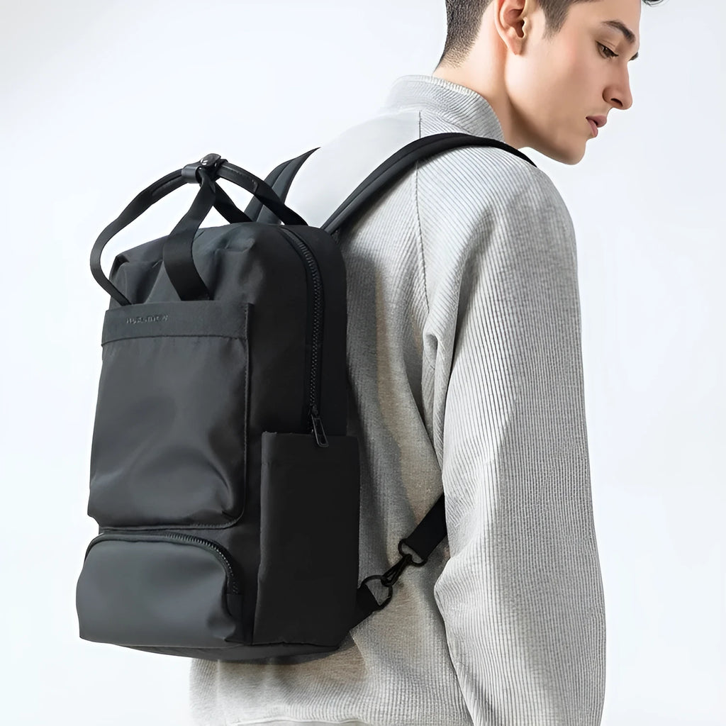 Black Oxford cloth lightweight computer backpack with 20-35 litre capacity.