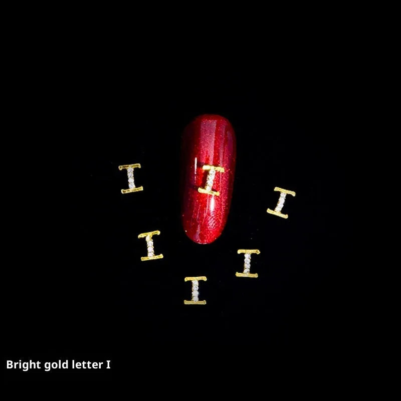 Gold alloy letter A nail ornament charm with crystal detail on a square chain base