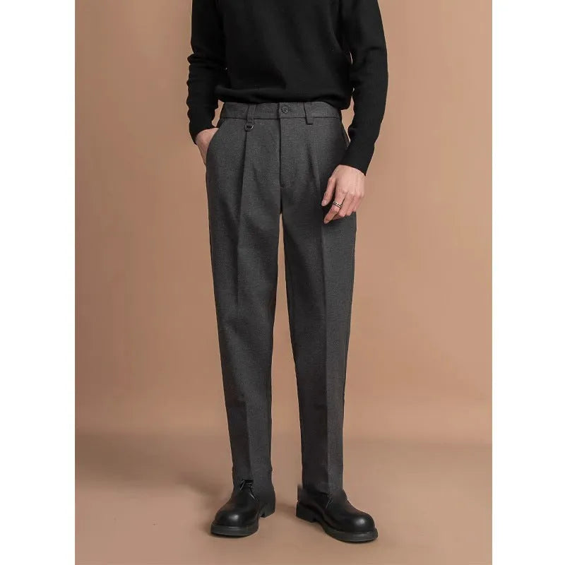 Men's straight-leg casual suit trousers in black, shown with a draped fit.