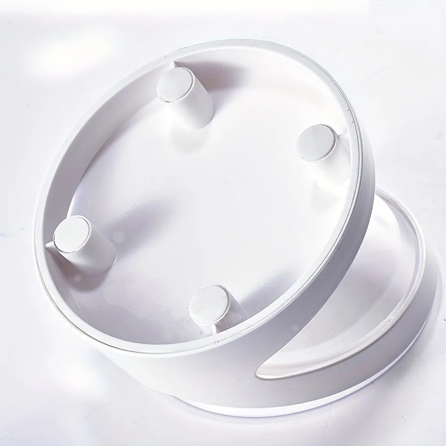 White clear plastic elevated cat food bowl with tilted anti-vomit design on a raised stand.
