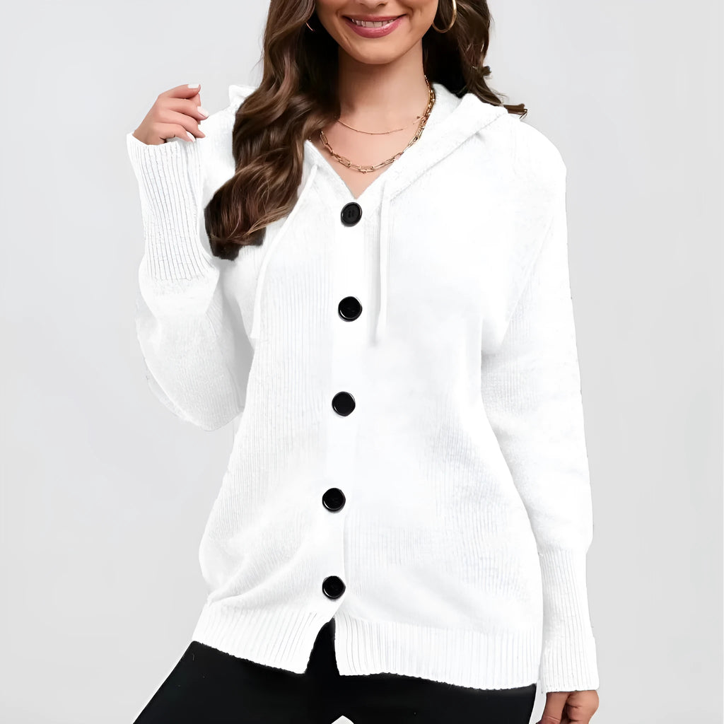 Woman wearing a loose fit, hooded, caramel-coloured cotton cardigan sweater with a textured pattern.