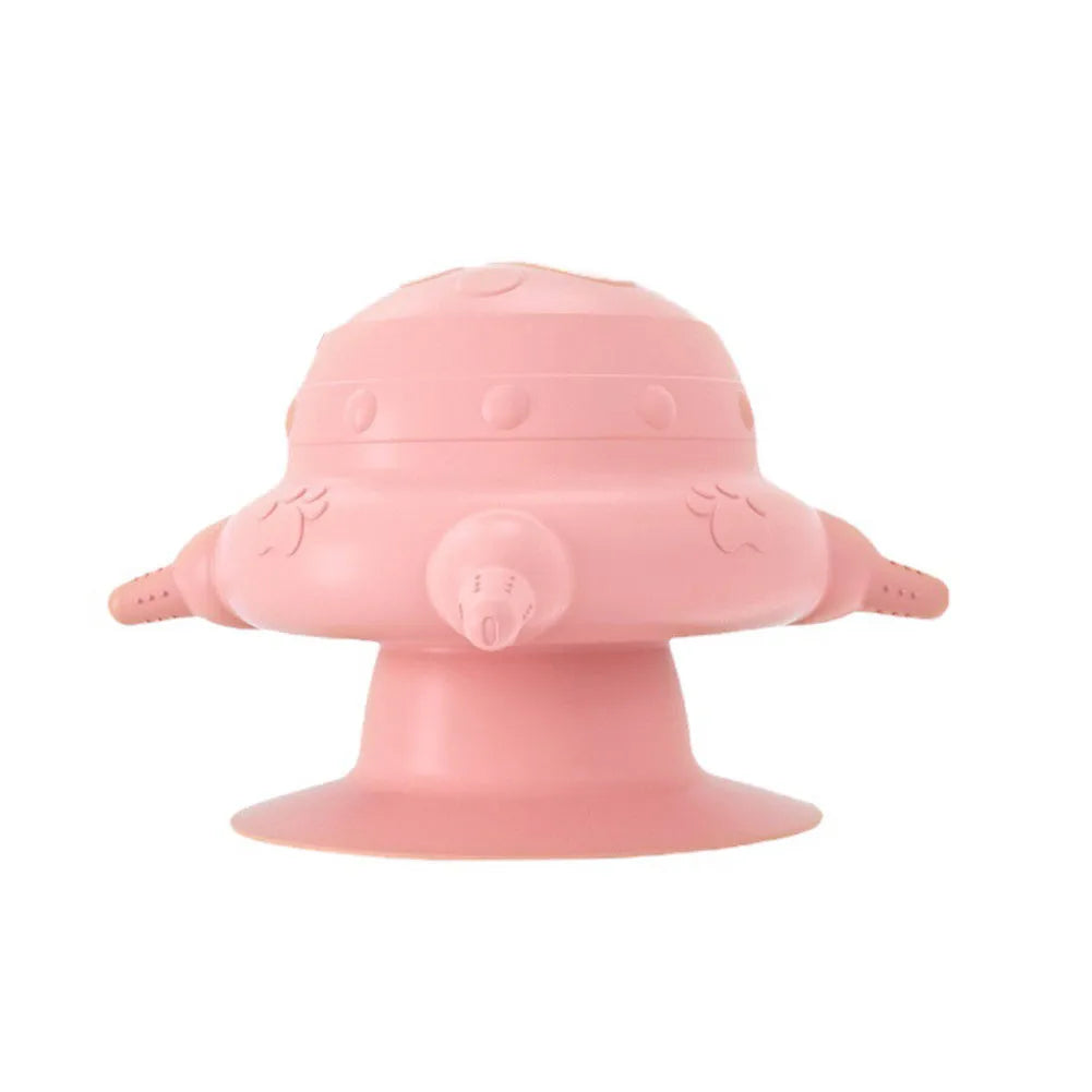 Pink silicone pet nursing feeder with bionic breast-shaped bowl and four pacifiers on a white background.