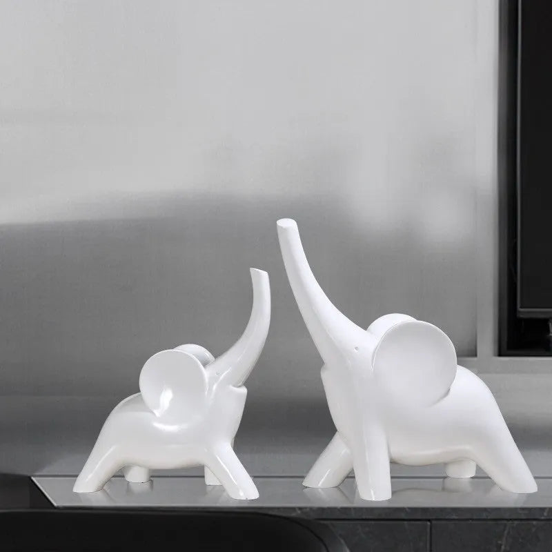 Minimalist solid resin elephant ornament in rose gold on a shelf.