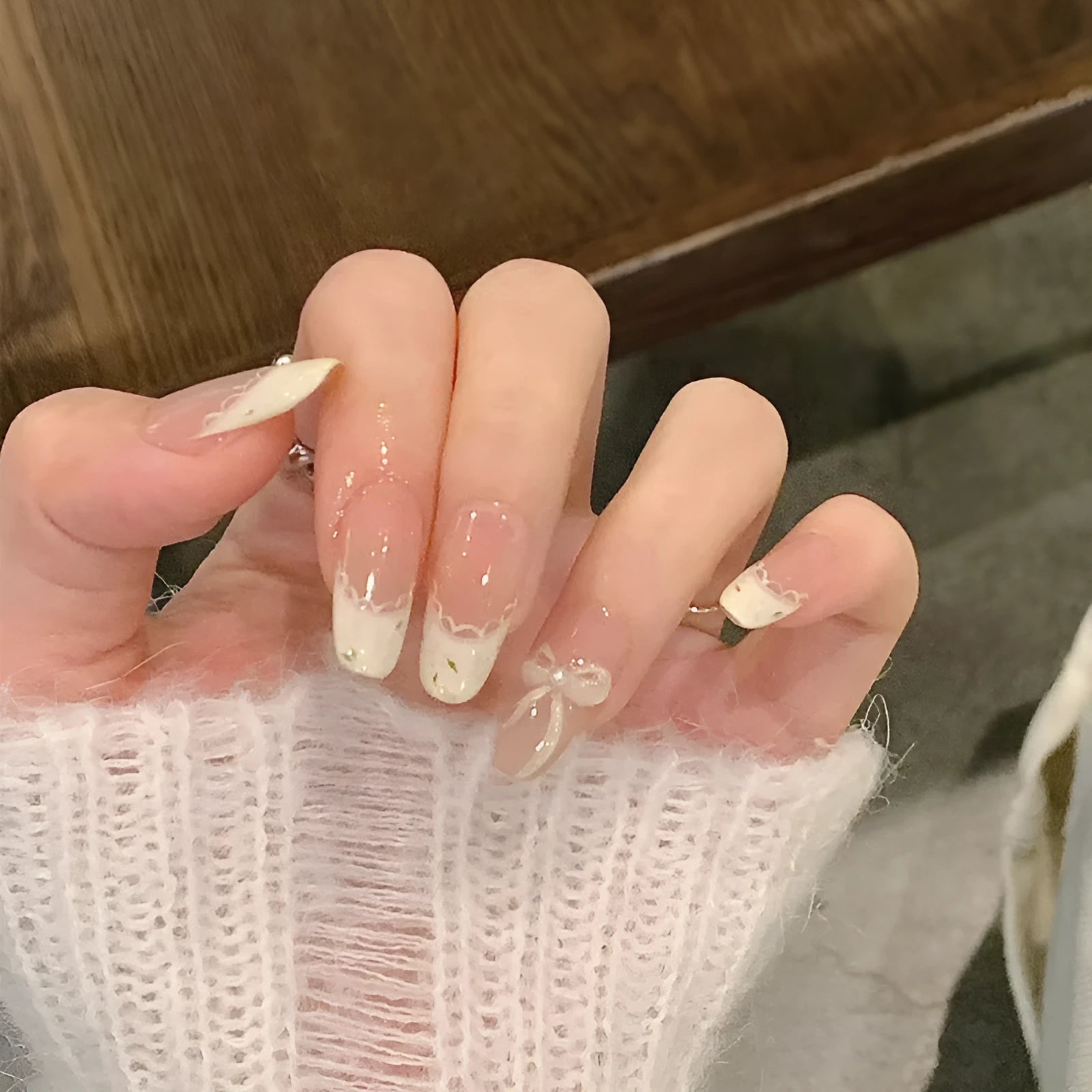 Set of sweet girl themed false nail tips with various designs for short to medium natural nails.