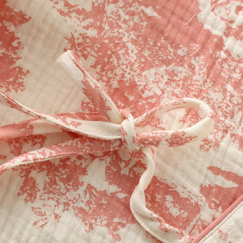 Women's pink pure cotton gauze lounge set with lace-up trousers and long sleeve top.