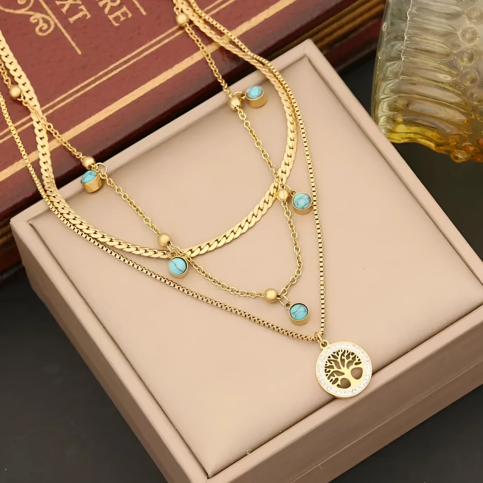Gold-plated multi-layer stainless steel necklace with geometric tree pendant on woman