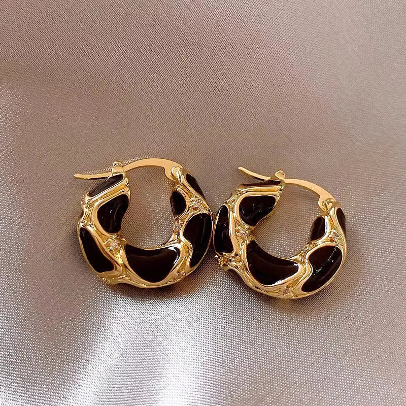 Gold plated alloy small hoop earrings with enamel colour in red, black, and white geometric shapes