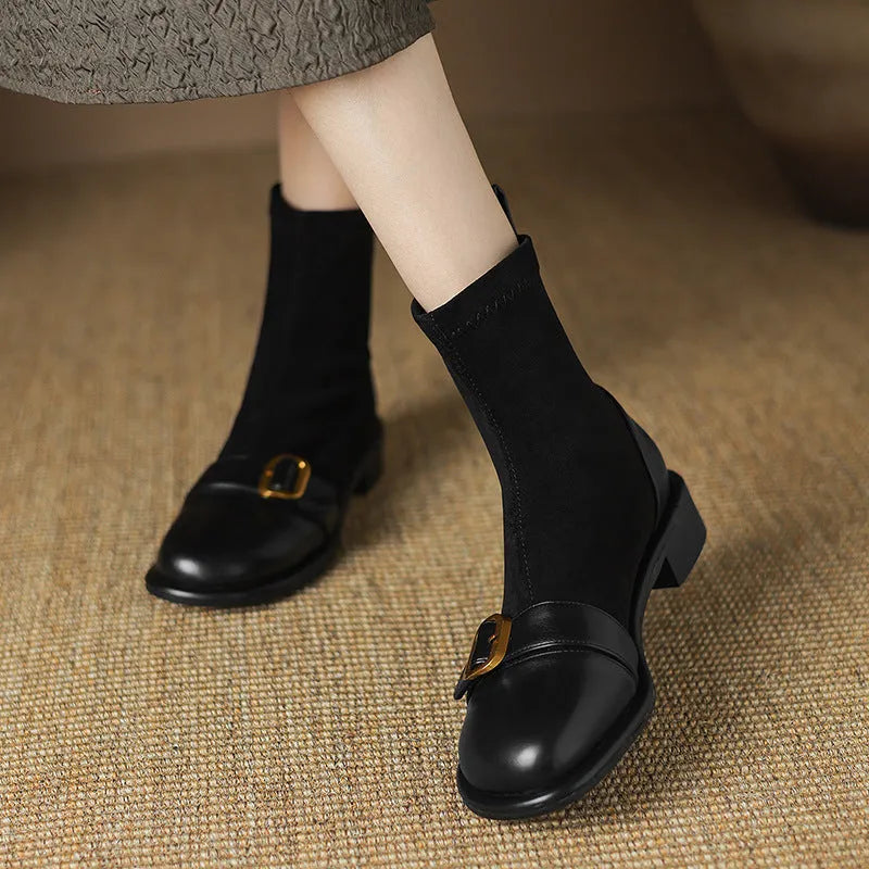 Women's black low heel Martin boots with belt buckle stitching and front lace-up design