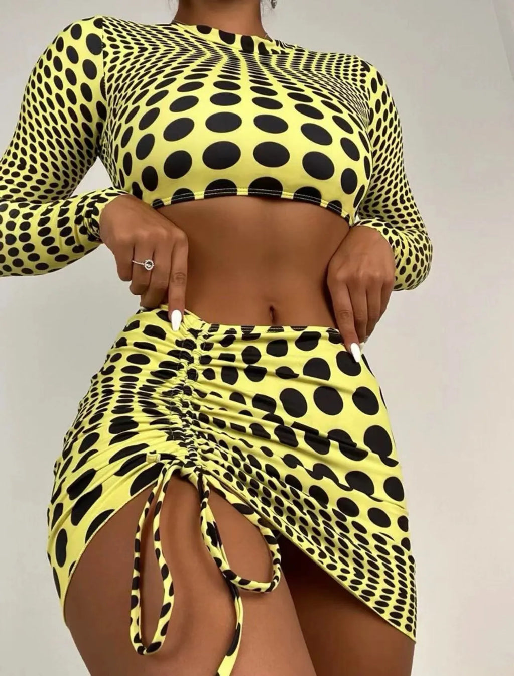 Women's green polka dot swimsuit three-piece set with matching top and skirt