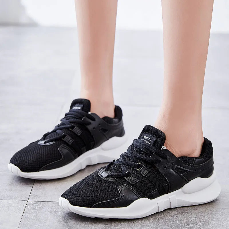 Men's low-top casual sneakers with hollow white mesh upper and round toe on a flat EVA sole.