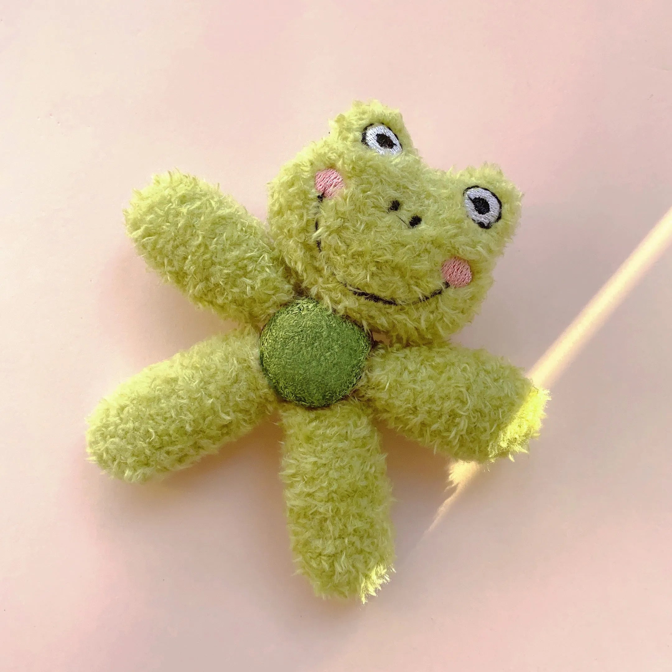 Edible catnip chewing ball in plush animal design with cat grass filling for dental cleaning