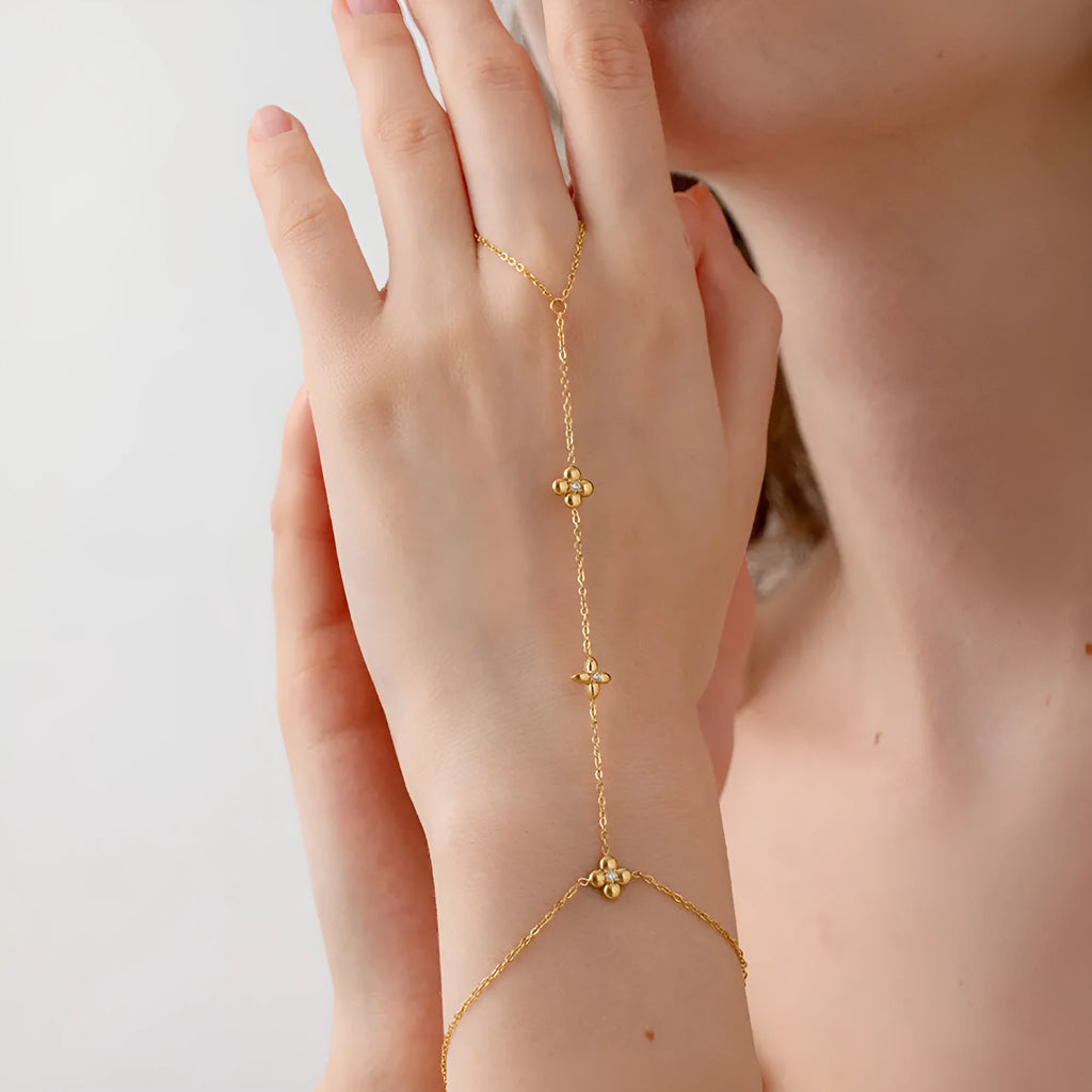Gold stainless steel women's bracelet with geometric flower and eight-pointed stars design