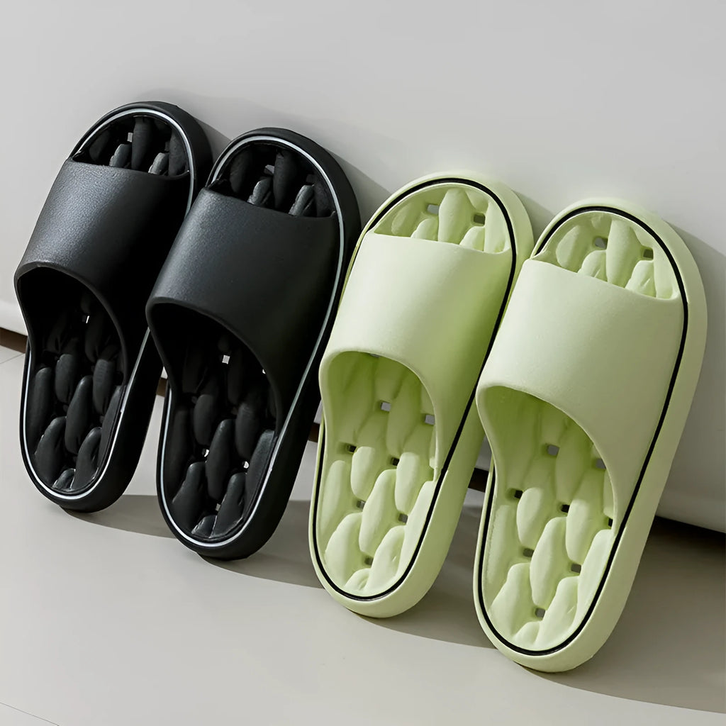 Non-slip EVA bathroom slippers with thick sole and hollow upper in grey, side view