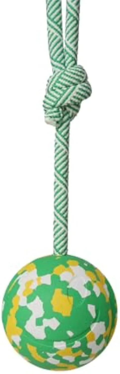 Natural rubber dog ball attached to a nylon rope for fetch and tug play.