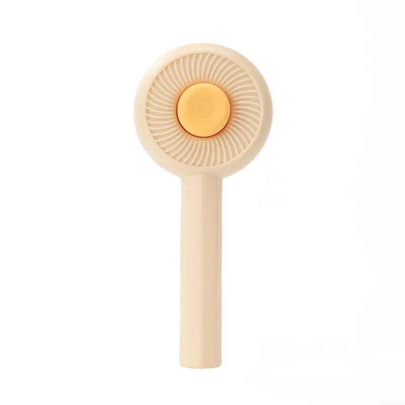 Blue pet grooming brush with self-cleaning button and angled metal pins for cats and dogs
