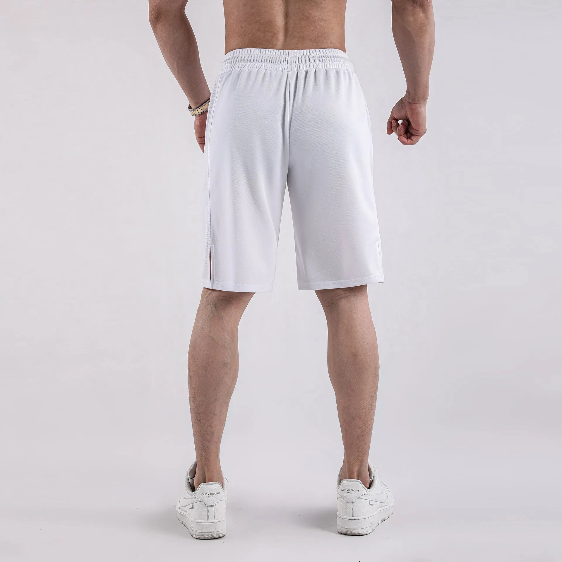 Men's black and white quick-dry mesh shorts with elastic waistband and loose fit