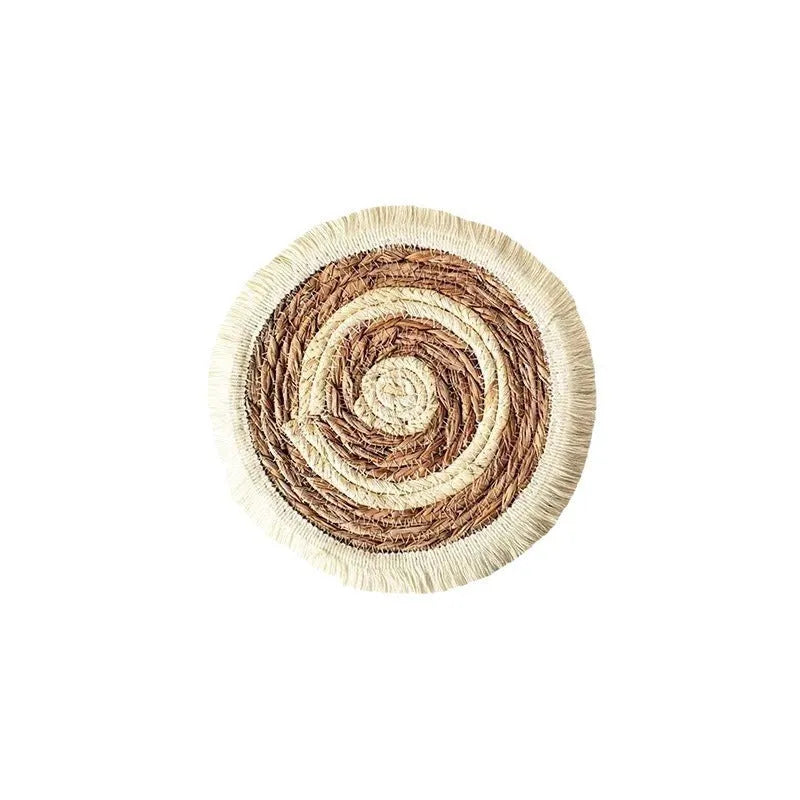 Japanese straw round placemat with tassel trim in natural papyrus material on dining table