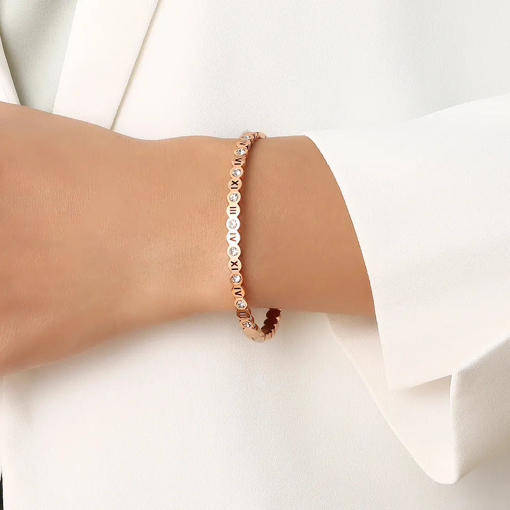 Titanium steel bracelet with number design in gold, rose gold, and steel colour options.