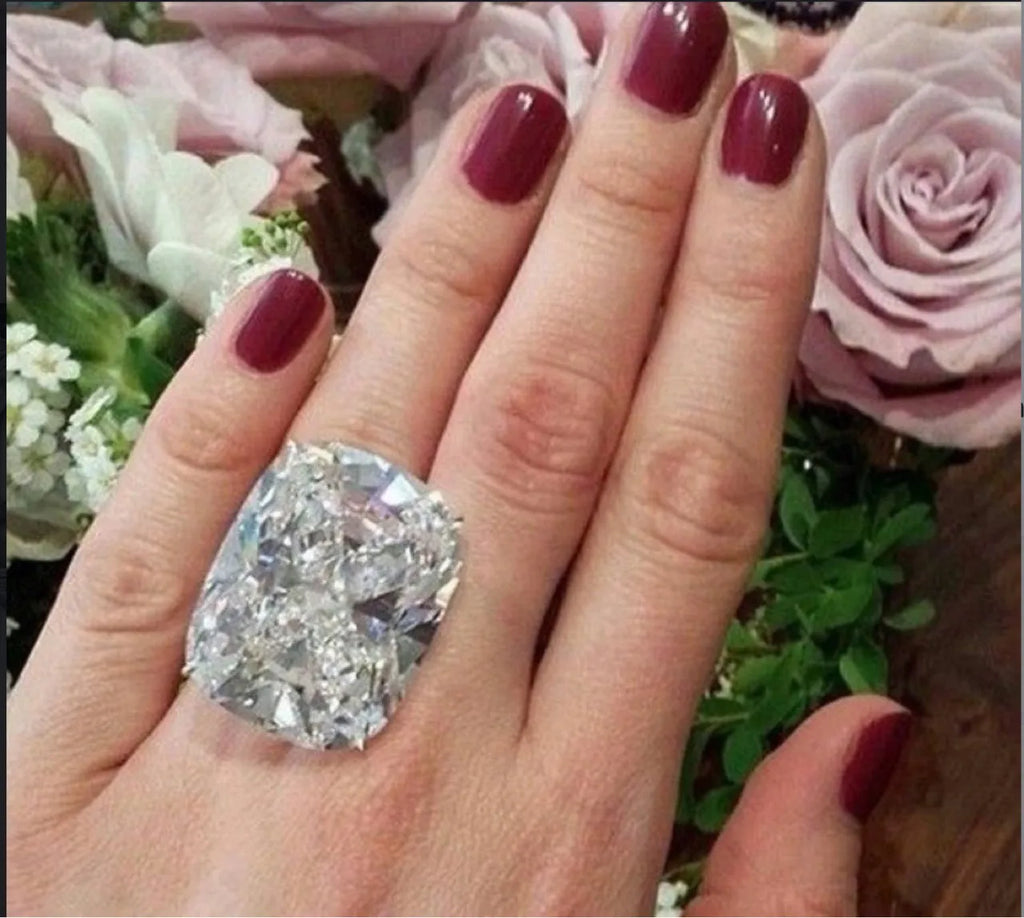 Women's white gold electroplated square diamond ring with geometric design on finger