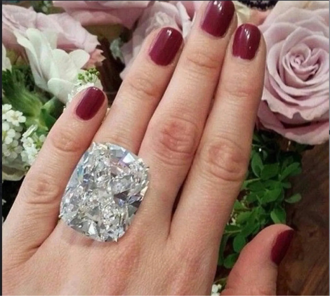 Women's white gold electroplated square diamond ring with geometric design on finger