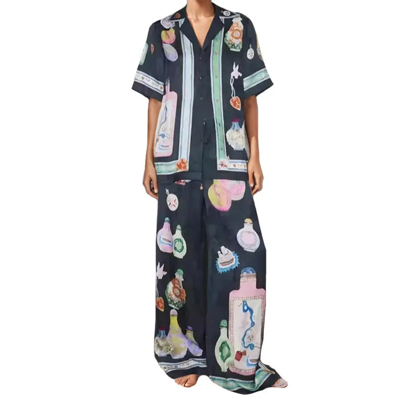 Black women's casual set with cartoon print, showing cardigan and matching trousers