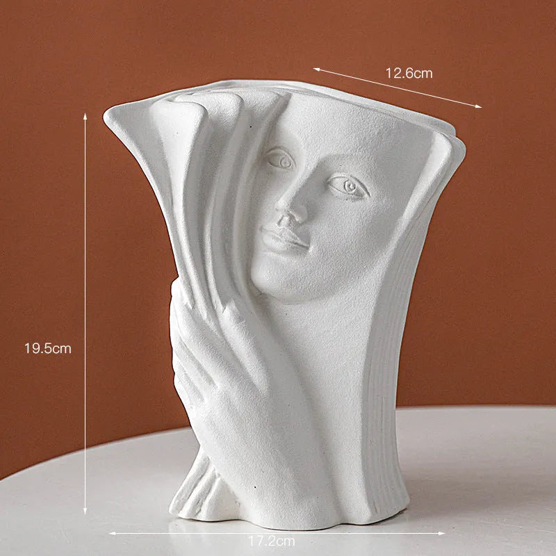 Glazed ceramic book stand in one of four artistic styles: lover, dancer, beauty and beast, or brushed face.