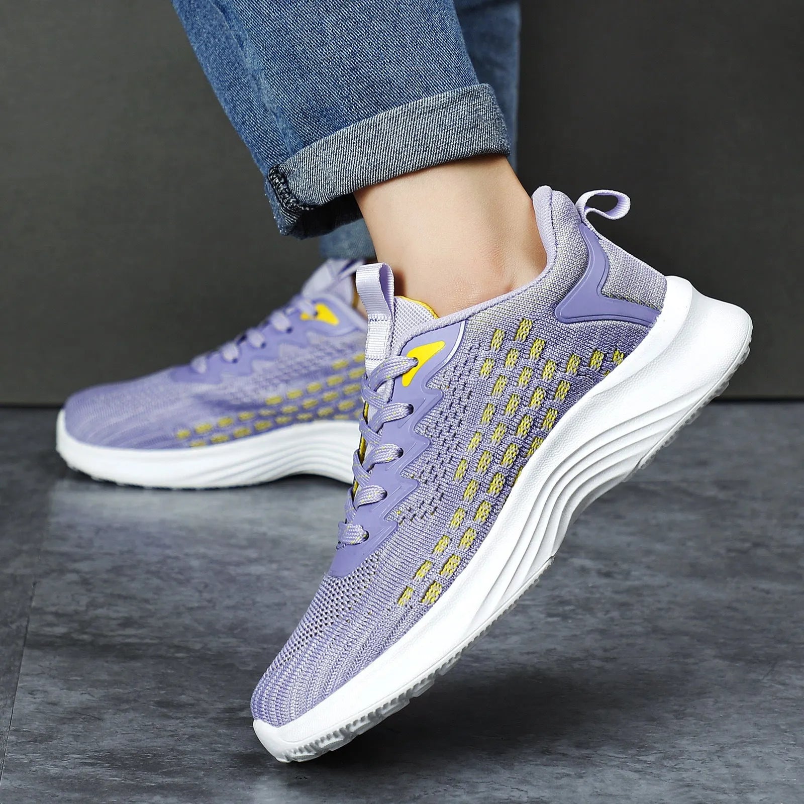Lavender purple women's Flyknit running shoes with striped pattern, mesh lining, and a flat EVA wedge sole.