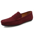 Men's solid colour suede loafers with round toe and rubber sole on a neutral background.