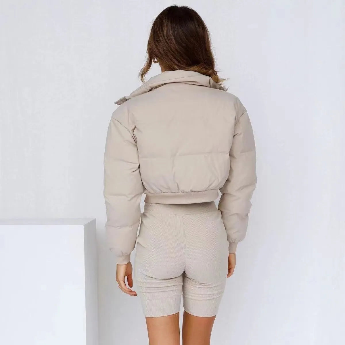 Women's loose blue polyester casual jacket with long sleeves on a hanger.