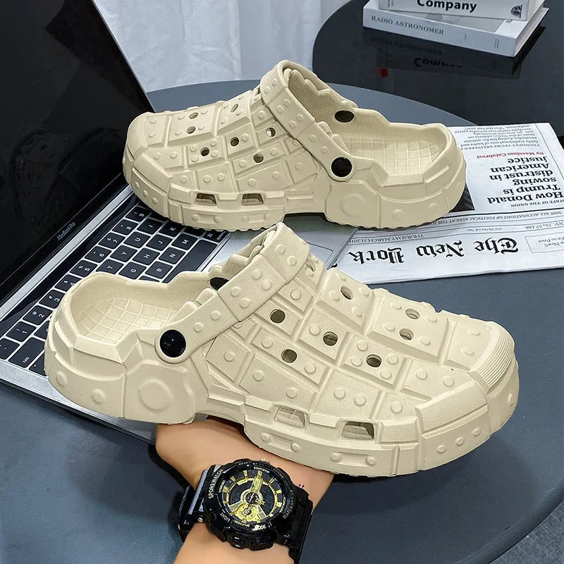 Men's black EVA slippers with thick sole, non-slip tread, and toe separator design on a white background.