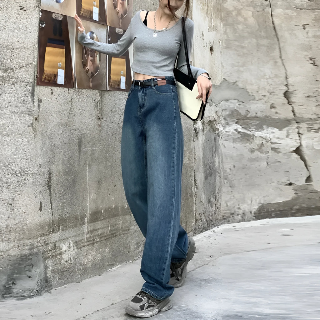 A pair of women's retro blue high-waisted straight-leg jeans laid flat, showcasing the classic five-pocket design.