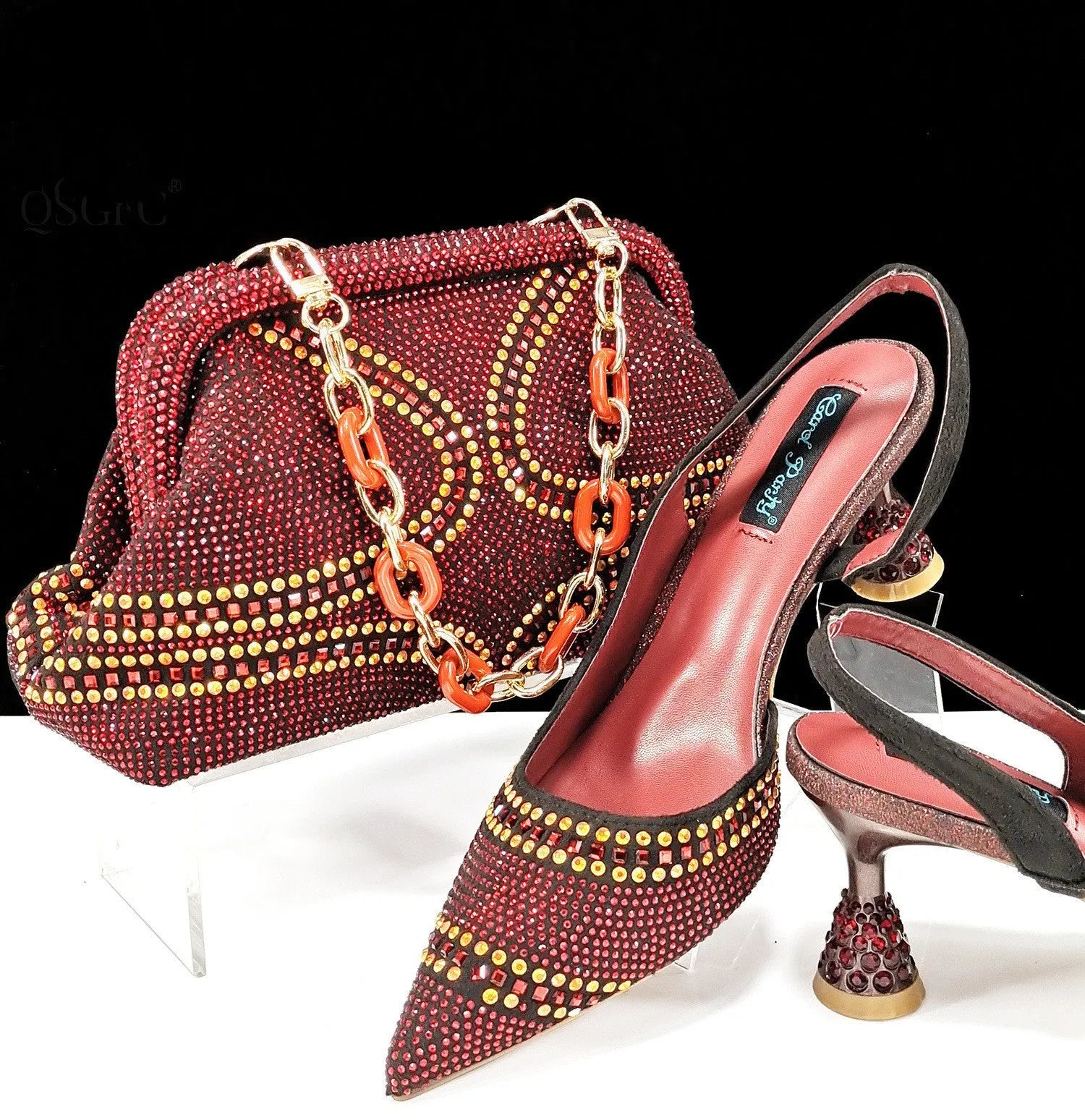Women's pointed toe high heels with rhinestones and a matching small bag, shown in one of eight available colours.
