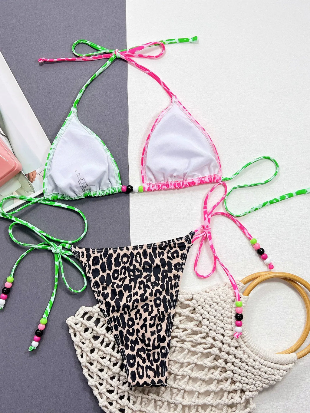 Women's leopard print bikini swimsuit with bra and briefs on white background
