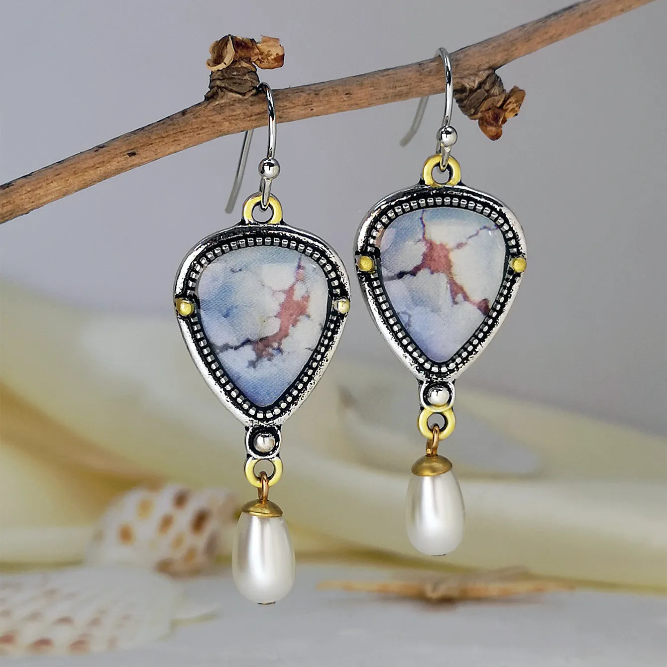 Retro blue drop earrings with geometric design featuring synthetic opal and pearl elements on electroplated metal