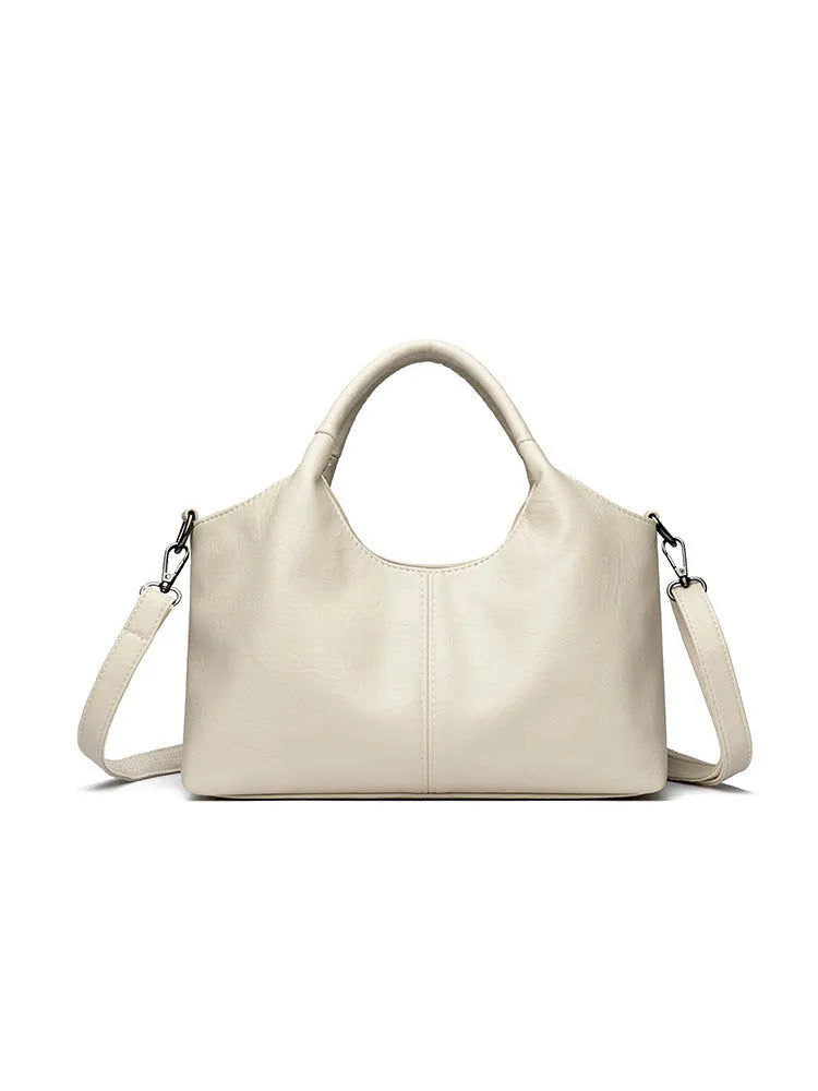 Genuine leather women's cross-body bag in multiple colours showing large capacity design