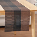 PVC non-slip dish mat in modern simple style on a dining table, showing gradient bamboo black colour option.