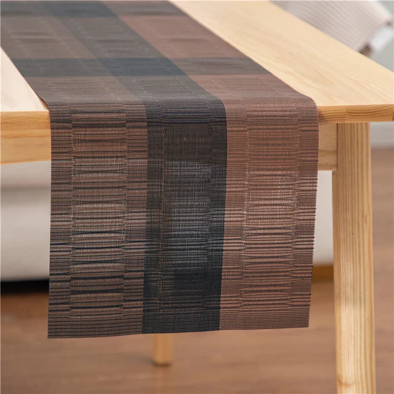 PVC non-slip dish mat in modern simple style on a dining table, showing gradient bamboo black colour option.