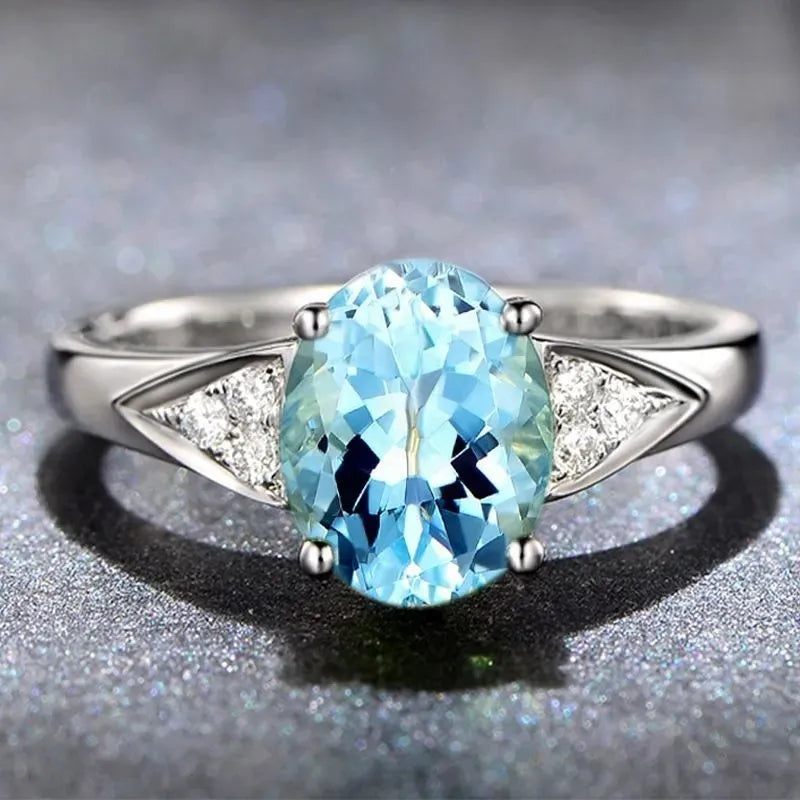Women's court ring with natural zircon inlay showing heart, water drop and bell patterns in blue colour option