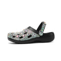 Black women's platform sandals with rhinestone decoration and a thick EVA sole.