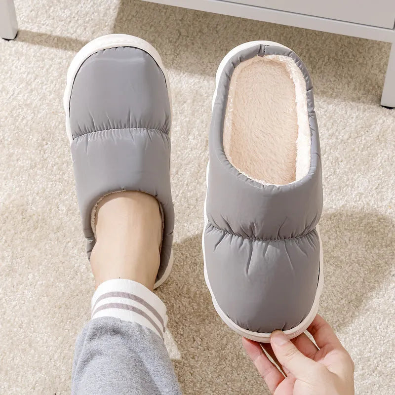 Down cotton winter slippers with artificial leather upper, thick rubber sole, and plush lining in blue colour