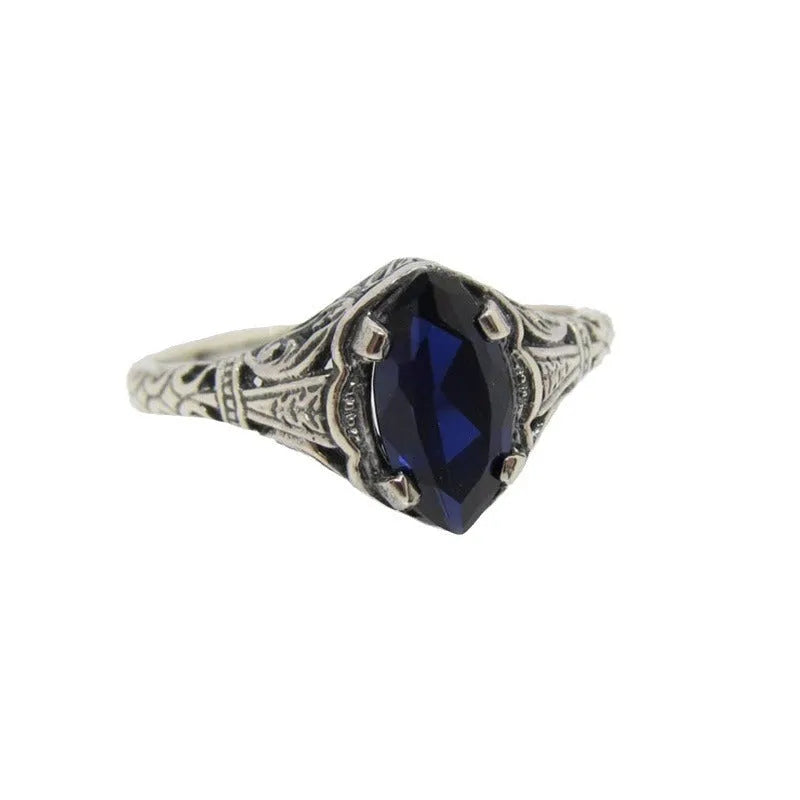Women's geometric hollow ring in silver electroplated alloy showing openwork pattern