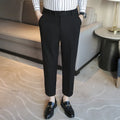 Retro brown straight leg corduroy trousers with elastic waistband laid flat.