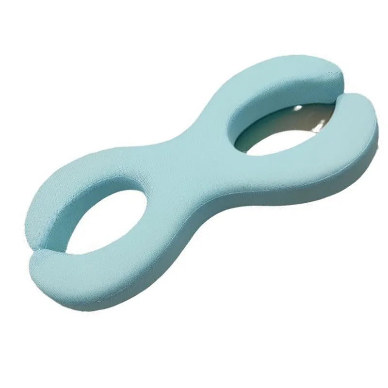 Cool blue memory foam cervical pillow with cylindrical traction design for neck support.