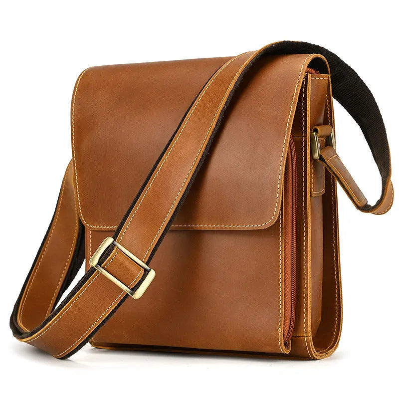 Men's dark brown Crazy Horse leather crossbody bag with visible stitching, shown holding A4 documents.