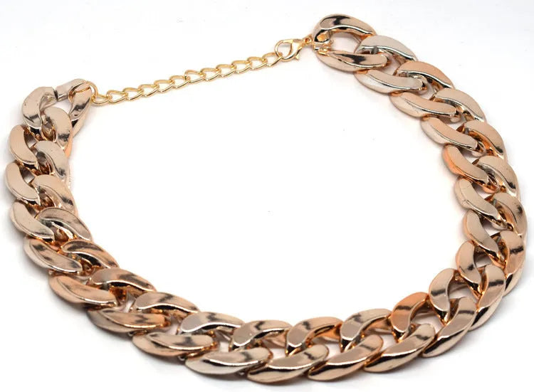 Geometric twisted chain dog collar in metallic colours showing adjustable buckle and chain links