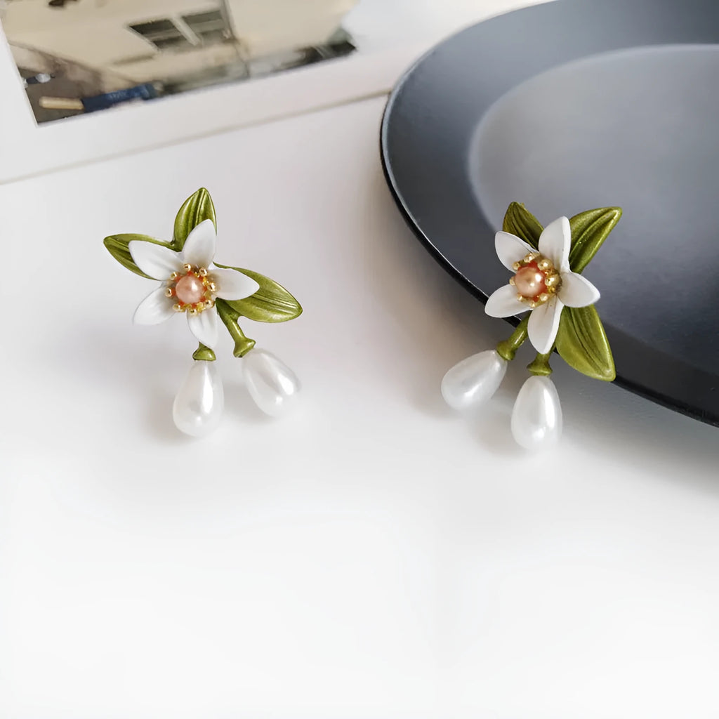 Women's sterling silver needle camellia flower earrings set with stud and clip options