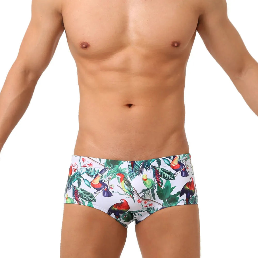 Men's floral and bird print nylon swimming trunks in boxer brief style.