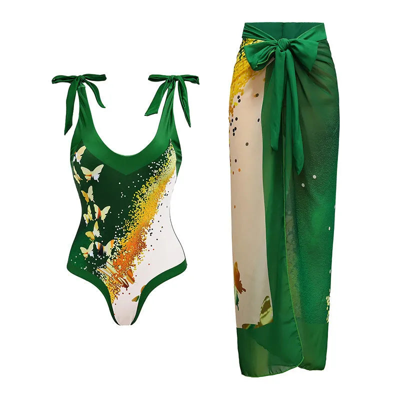 Solid colour women's one-piece swimsuit with spaghetti straps and a matching skirt.
