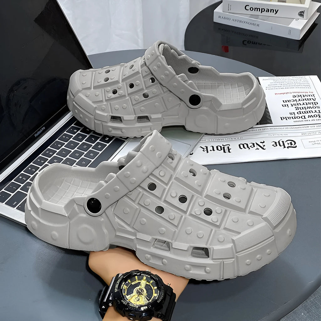 Men's black EVA slippers with thick sole, non-slip tread, and toe separator design on a white background.